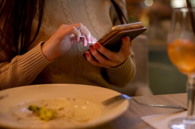 A close-up shot of a person using a meal planning app on their smartphone, with a calendar and various food containers visible in the background, symbolizing the organization and technology involved in modern meal planning.