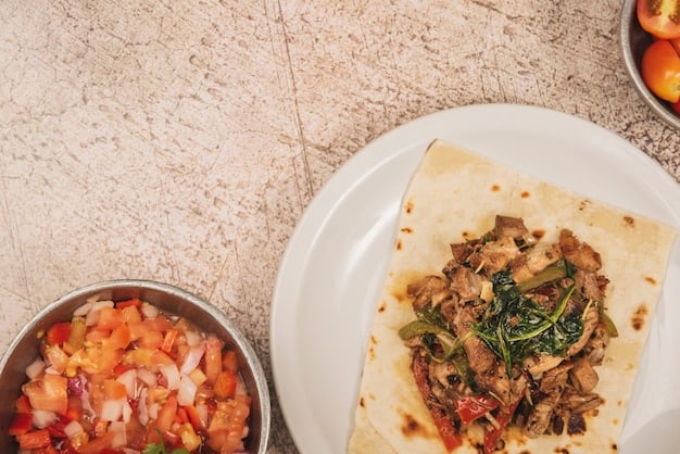 An overhead shot of a completed sausage and pepper fajita sheet pan with tortillas and various toppings on the side (salsa, guacamole, sour cream). The colors are vibrant, and the presentation is appetizing.