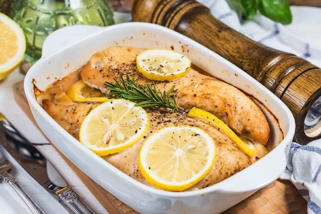 Close-up of a Lemon Herb Chicken and Rice dish in a pot, showcasing the juicy chicken pieces, fluffy rice, and fresh herbs. The dish is garnished with lemon slices, emphasizing the lemon flavor.