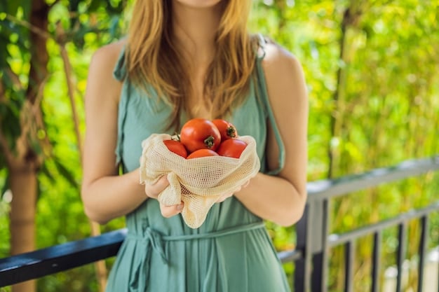 Close-up shot of a person's hands harvesting ripe tomatoes from a garden, with a woven basket filled with other freshly picked vegetables in the background. Focus on the vibrant colors and textures of the produce.