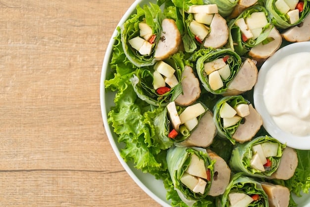 An overhead shot of several turkey lettuce wraps garnished with chopped peanuts and cilantro. The wraps look fresh and inviting.