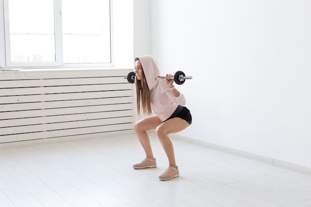 A woman performing squats with proper form using dumbbells in a well-lit gym.