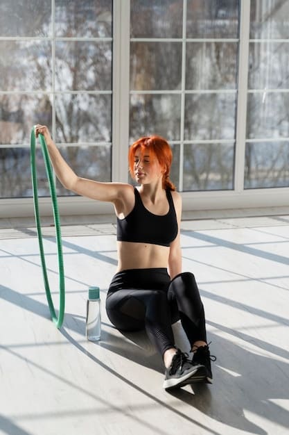 A person stretching with resistance bands after a HIIT workout, focusing on flexibility and muscle recovery.