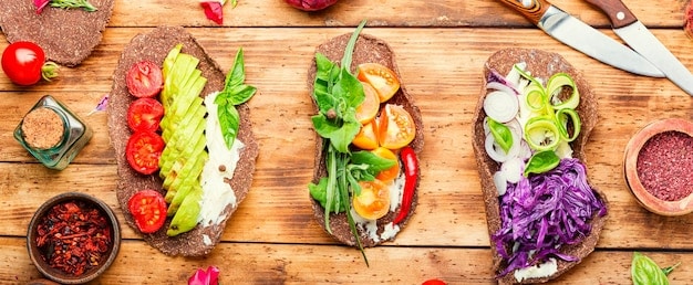 A split image showing two sandwiches side-by-side: one made with fresh, whole ingredients (vegetables, whole grain bread, lean protein), and the other made with processed ingredients (white bread, processed meats, artificial spreads).