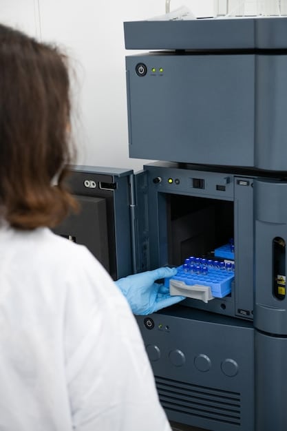 A close-up of a DNA sequencing machine in a modern laboratory, with a scientist in the background analyzing the data on a computer screen. The focus is on the technology and precision involved in genetic testing.