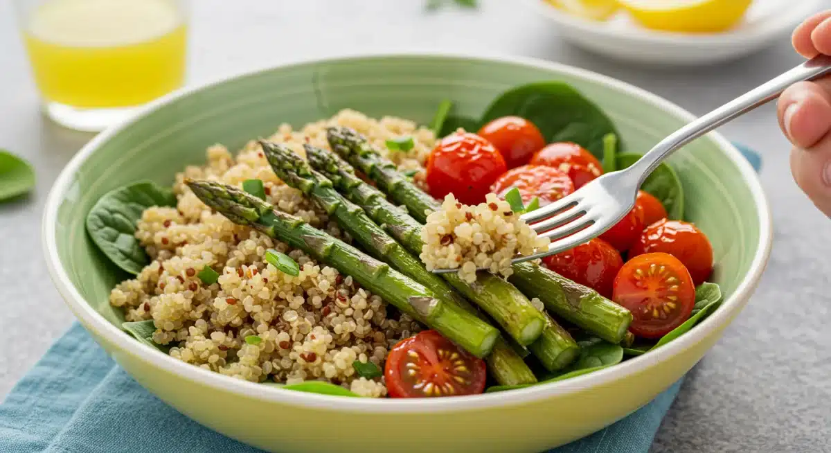 Colorful quinoa bowl with roasted asparagus and fresh vegetables