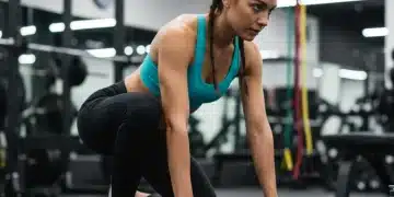 Athlete using foam roller for muscle recovery after intense workout